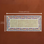 A rectangular woven placemat with a floral border and white trim, shown on a brown background with white dimension arrows indicating 35 inches by 15 inches.