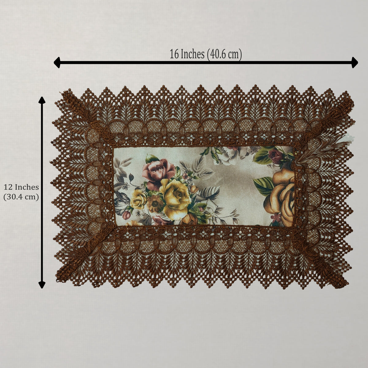 A rectangular lace placemat with a floral printed center and brown lace border, shown on a light background with dimension arrows indicating 16 inches by 12 inches.
