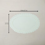 An oval white crocheted lace doily with dimension arrows and text indicating a width of 18 inches (45.7 cm) and a height of 12 inches (30.