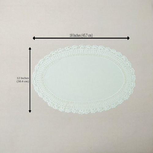An oval white crocheted lace doily with dimension arrows and text indicating a width of 18 inches (45.7 cm) and a height of 12 inches (30.