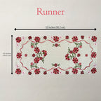 An embroidered table runner with a floral pattern, shown with dimension lines indicating a width of 32 inches (81.2 cm) and a height of 16 inches (40.