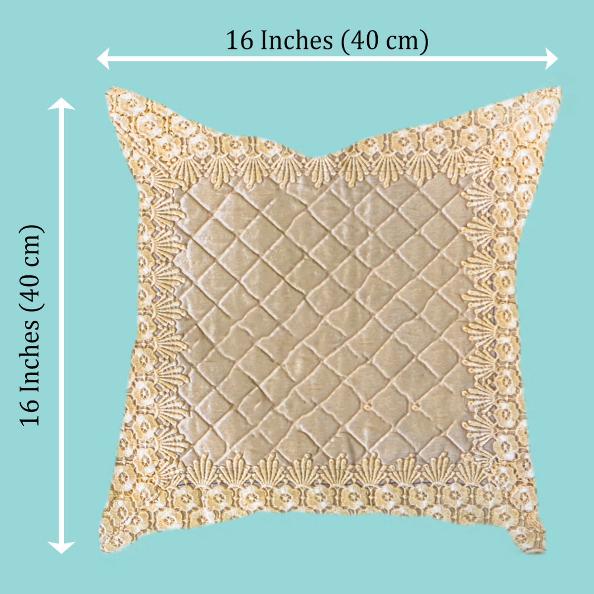 A square decorative throw pillow with a beige quilted center and an embroidered gold border, shown on a solid light blue background with dimension lines indicating 16 inches by 16 inches (40 cm) on each side.